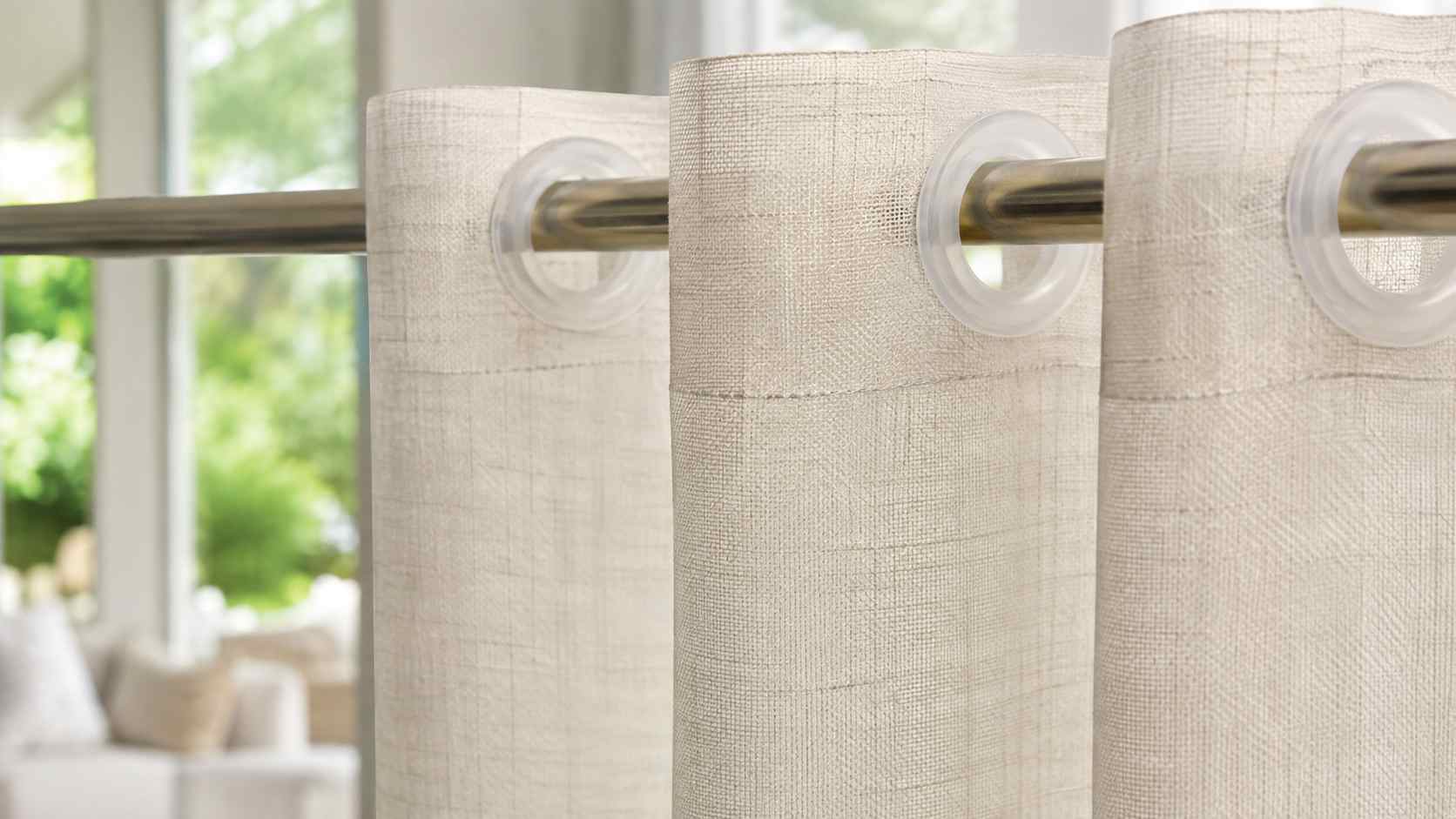 small curtain grommets, The small curtain grommets are installed along the top edge of the light-colored curtains.